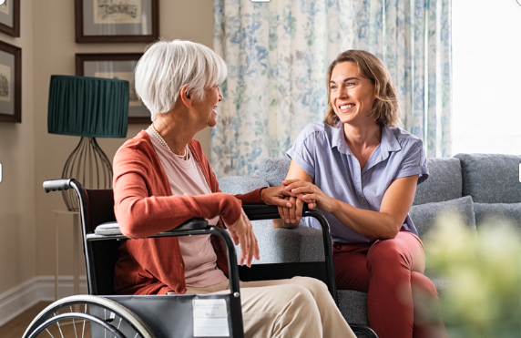 Caregiver engaging a memory care patient in meaningful interaction and activities